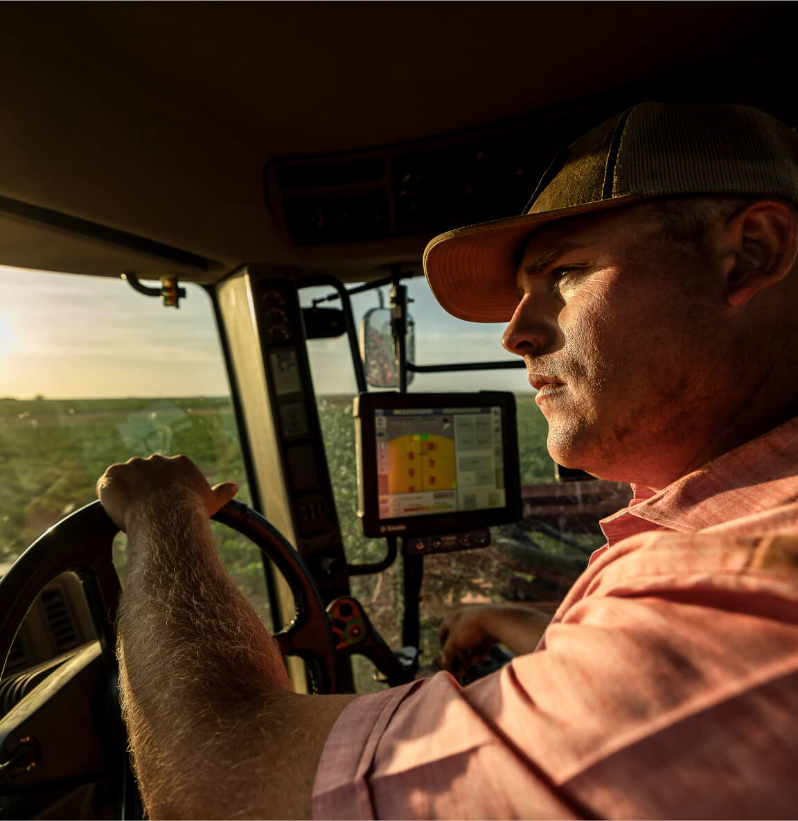 Young farmer driving a tractor