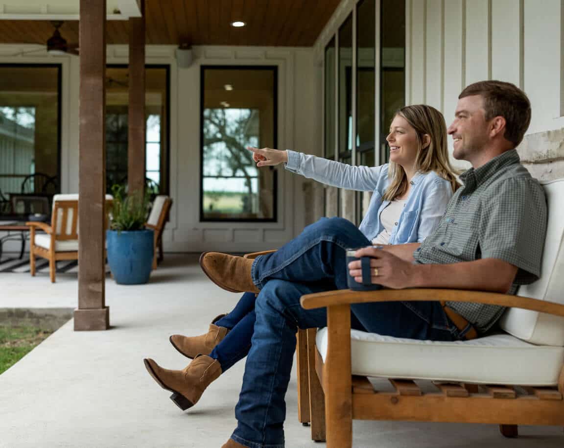 Young couple sitting on a porch swing